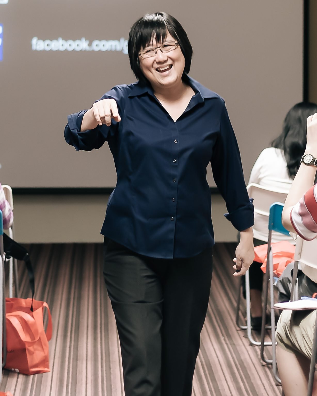 Goh Ai Yat speaking to a seminar audience
